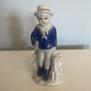 Porcelain blue & white Dutch school boy on his way to school